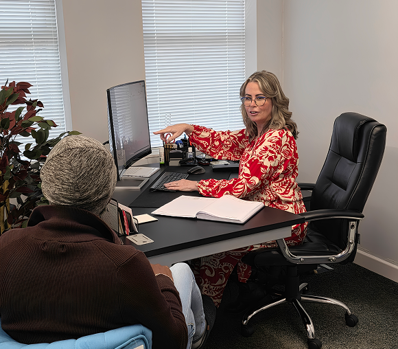 Two people discussing in an office.